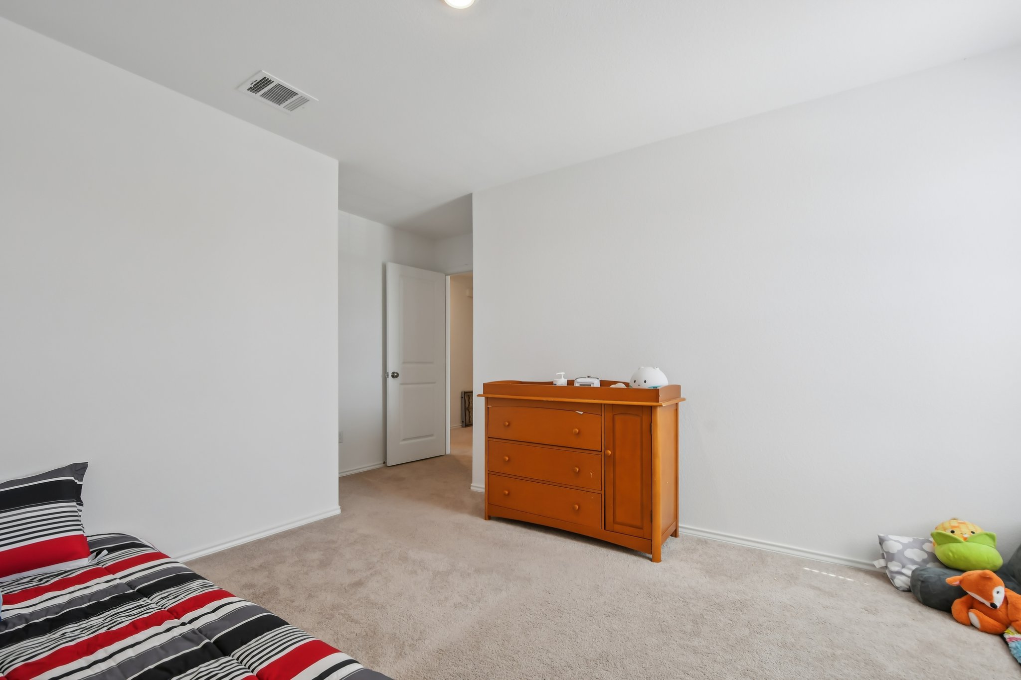 14116 Mussel Run Elgin, TX 78621 - Photo 20 of 40 Bedroom featuring light colored carpet and baseboards