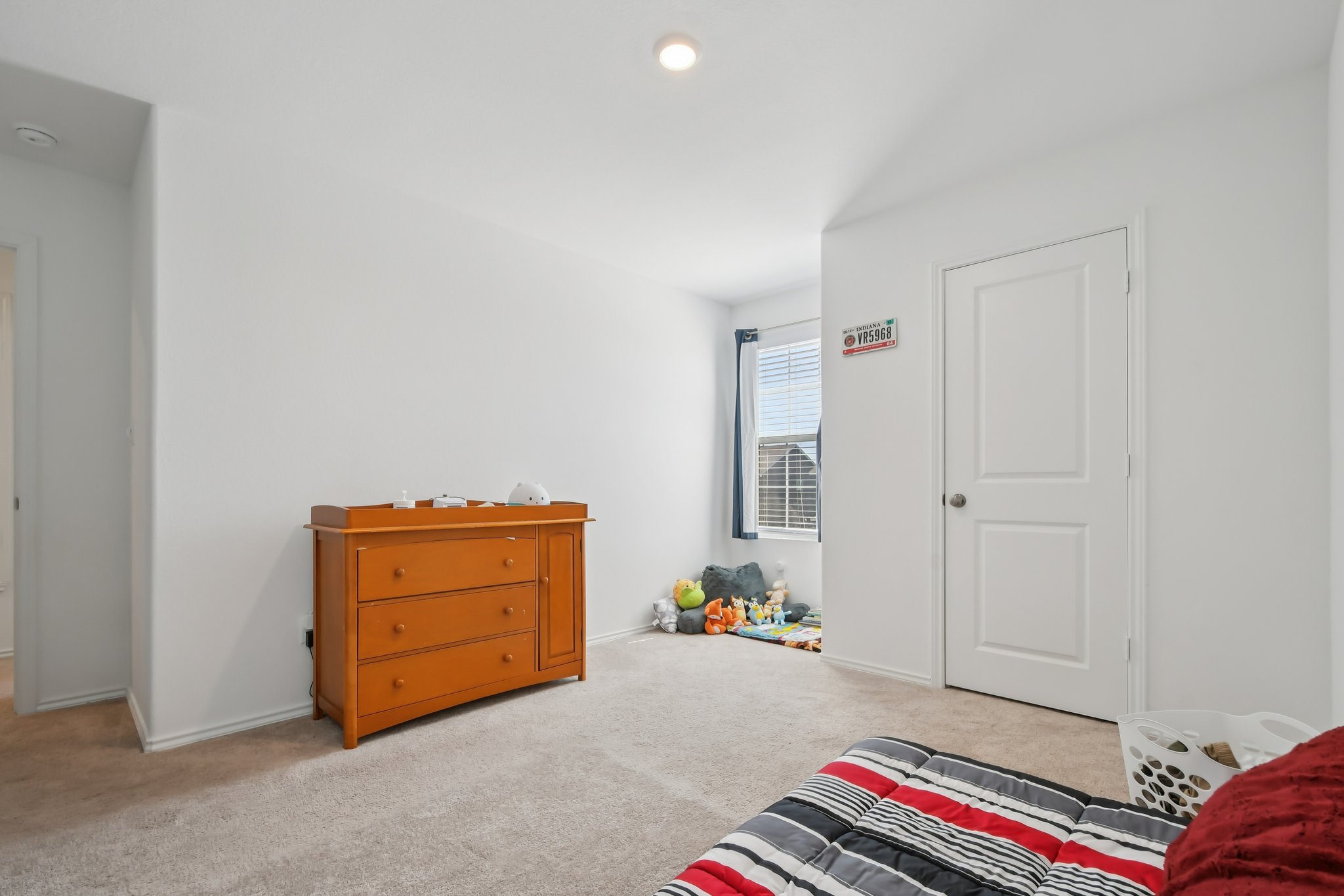 14116 Mussel Run Elgin, TX 78621 - Photo 21 of 40 Bedroom with light colored carpet and recessed lighting
