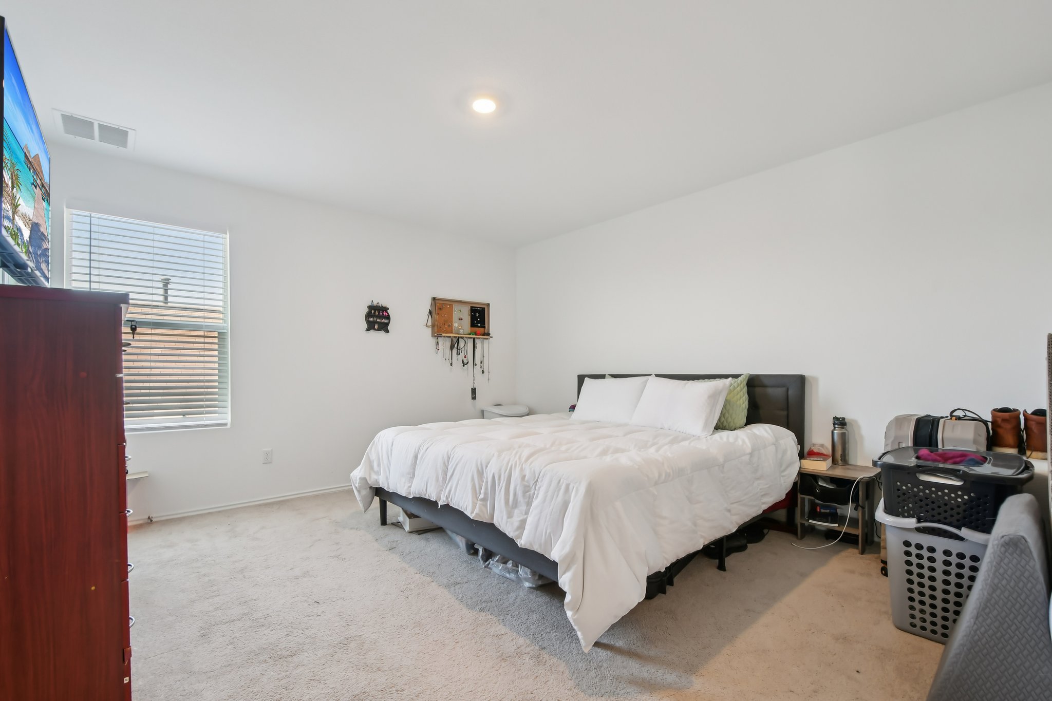 14116 Mussel Run Elgin, TX 78621 - Photo 22 of 40 Carpeted bedroom with baseboards