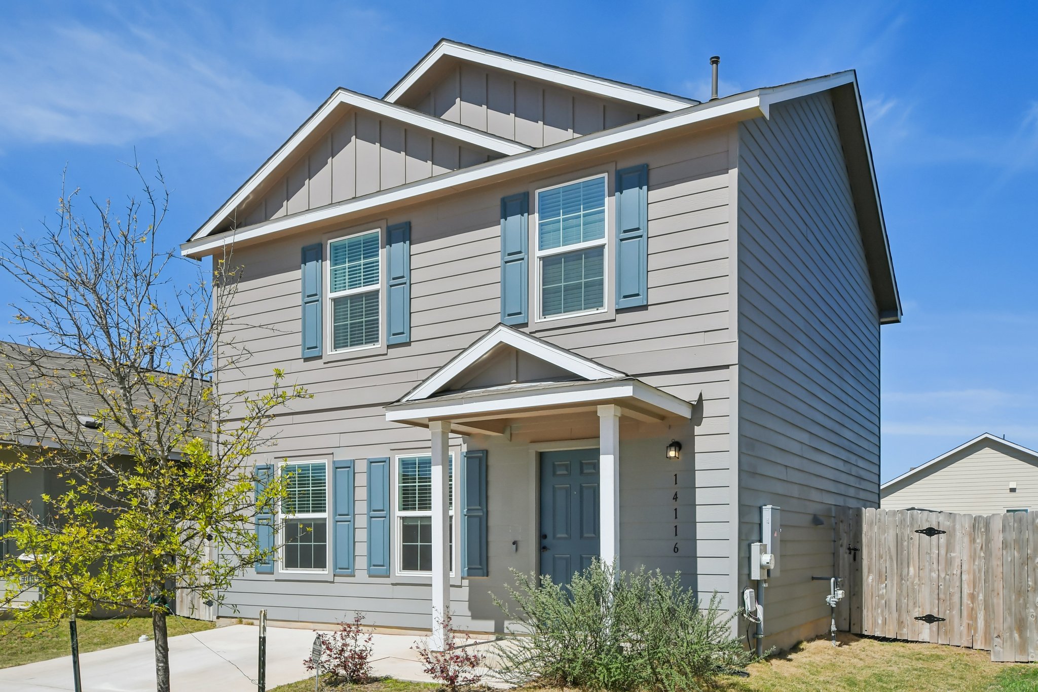 14116 Mussel Run Elgin, TX 78621 - Photo 34 of 40 View of front facade with board and batten siding and a gate