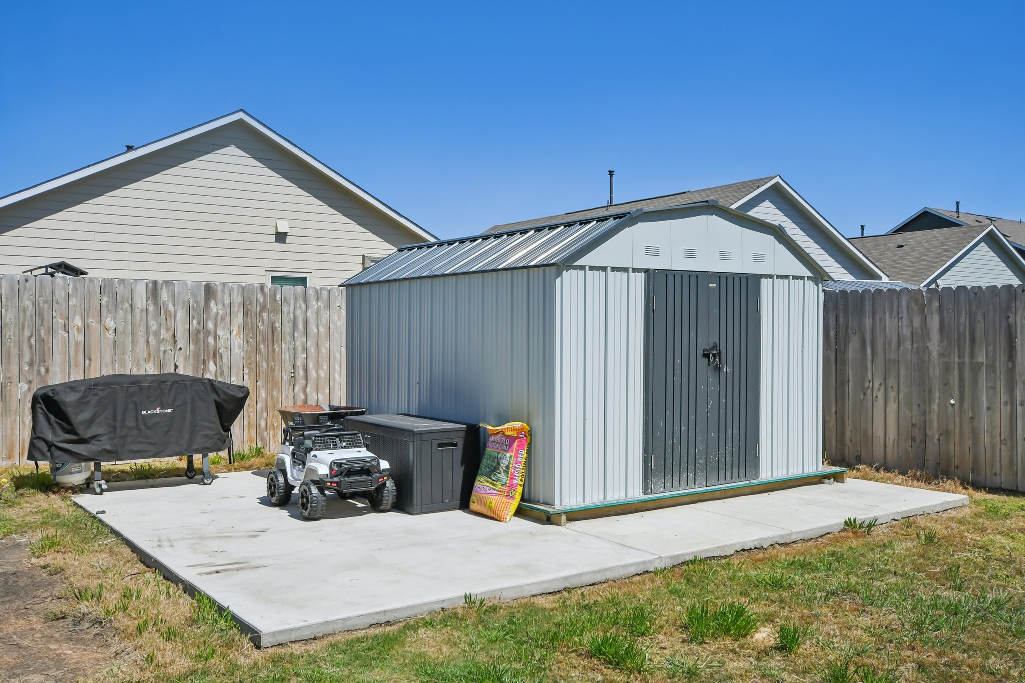 14116 Mussel Run Elgin, TX 78621 - Photo 38 of 40 View of shed with a fenced backyard