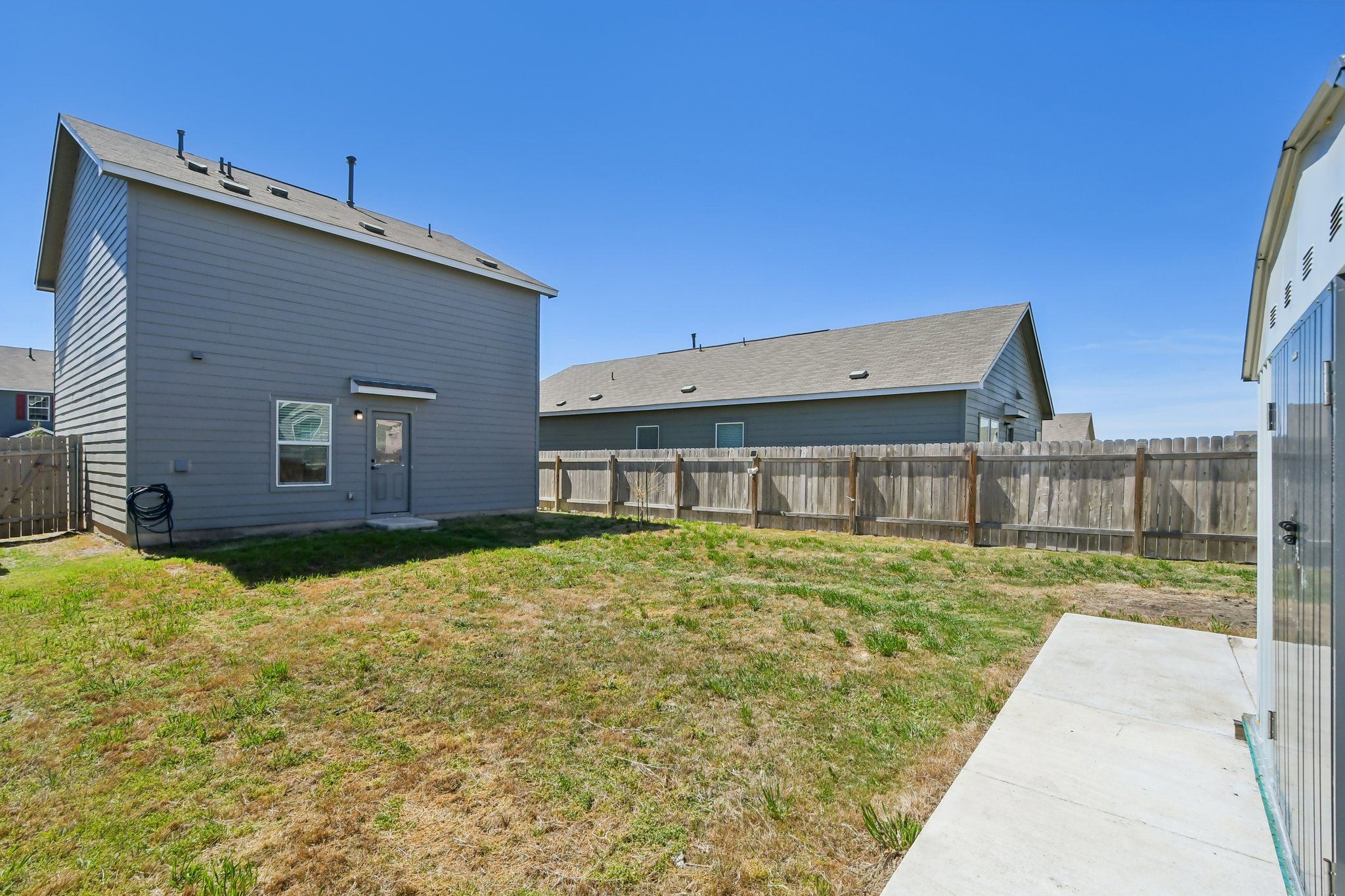 14116 Mussel Run Elgin, TX 78621 - Photo 40 of 40 Back of property with a fenced backyard