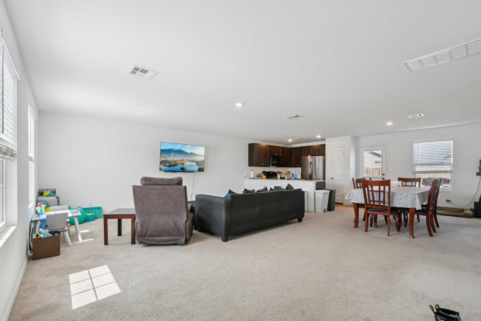 14116 Mussel Run Elgin, TX 78621 - Photo 5 of 40 Living room featuring light colored carpet and recessed lighting