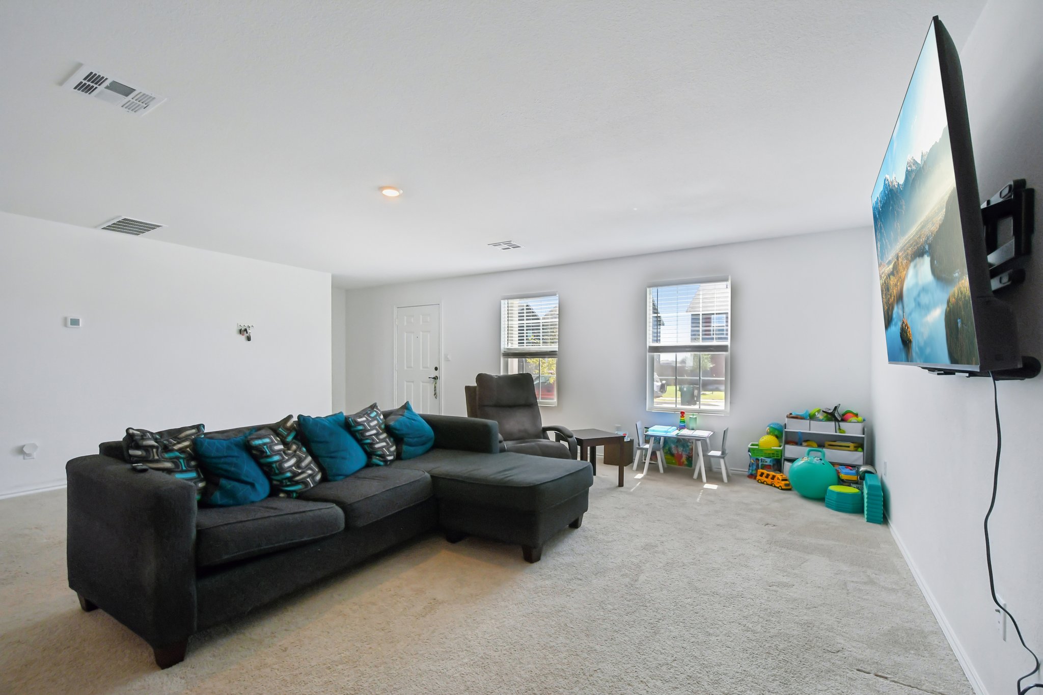 14116 Mussel Run Elgin, TX 78621 - Photo 9 of 40 Living area with baseboards and carpet floors