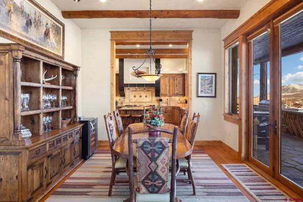 a view of a dining room with furniture and a window