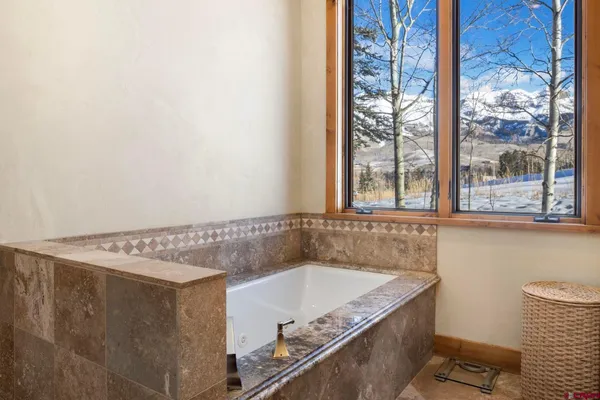 a bath tub sitting next to a window
