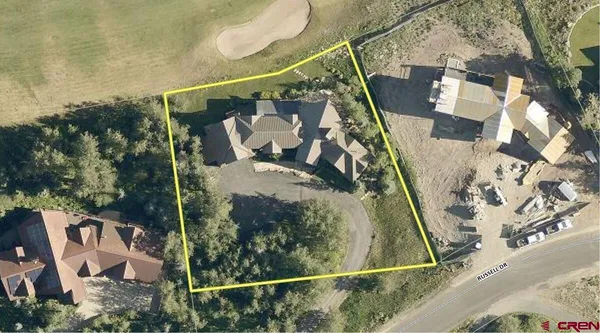 a view of house with a yard