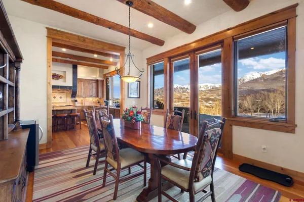a view of a dining room with furniture window and wooden floor