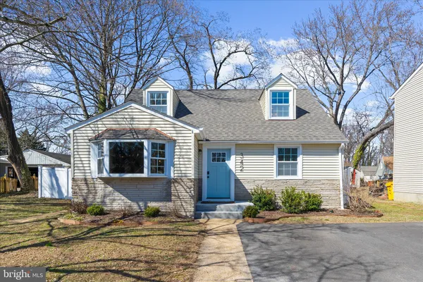 a front view of a house with yard