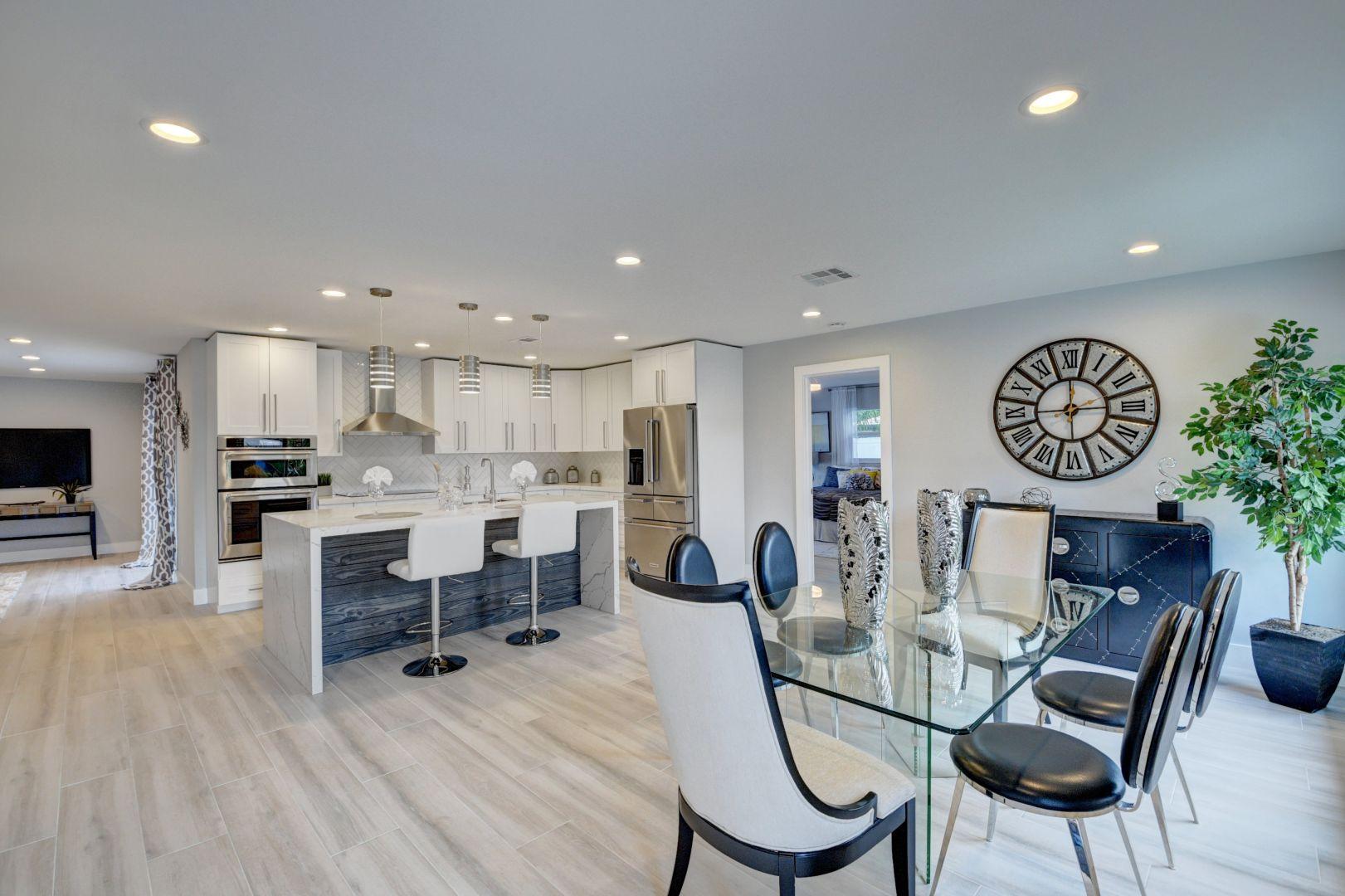 709 Sunshine Drive Delray Beach, FL 33444 - Photo 1 of 25 a view of a dining room with furniture