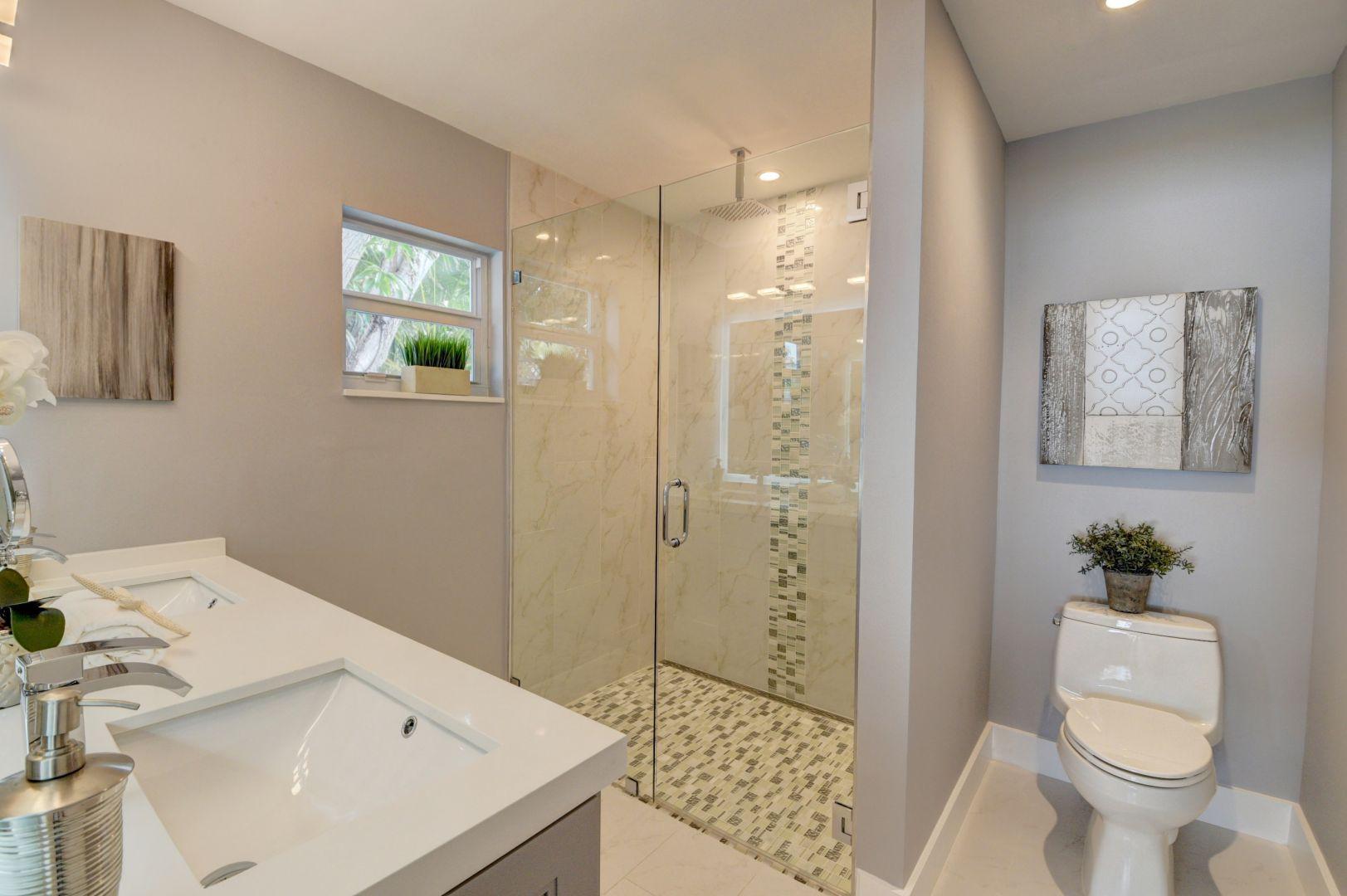 709 Sunshine Drive Delray Beach, FL 33444 - Photo 14 of 25 a bathroom with a sink toilet and shower