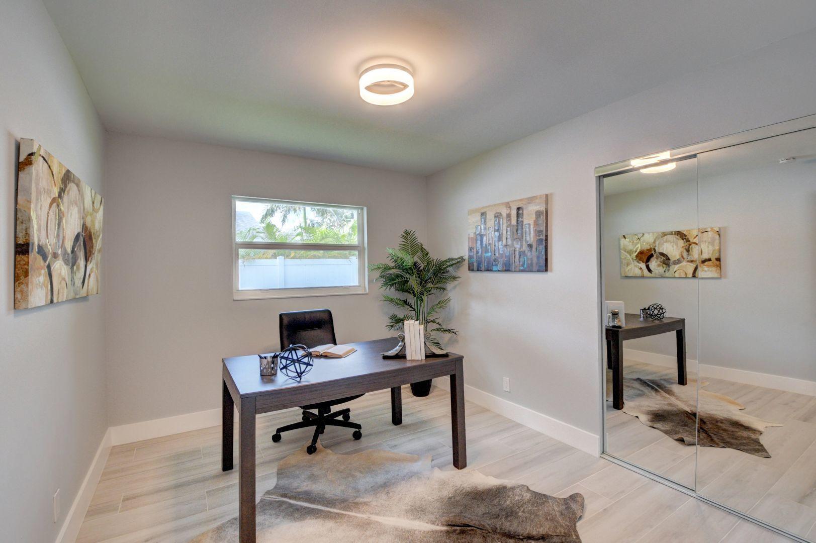 709 Sunshine Drive Delray Beach, FL 33444 - Photo 18 of 25 a view of a workspace with furniture