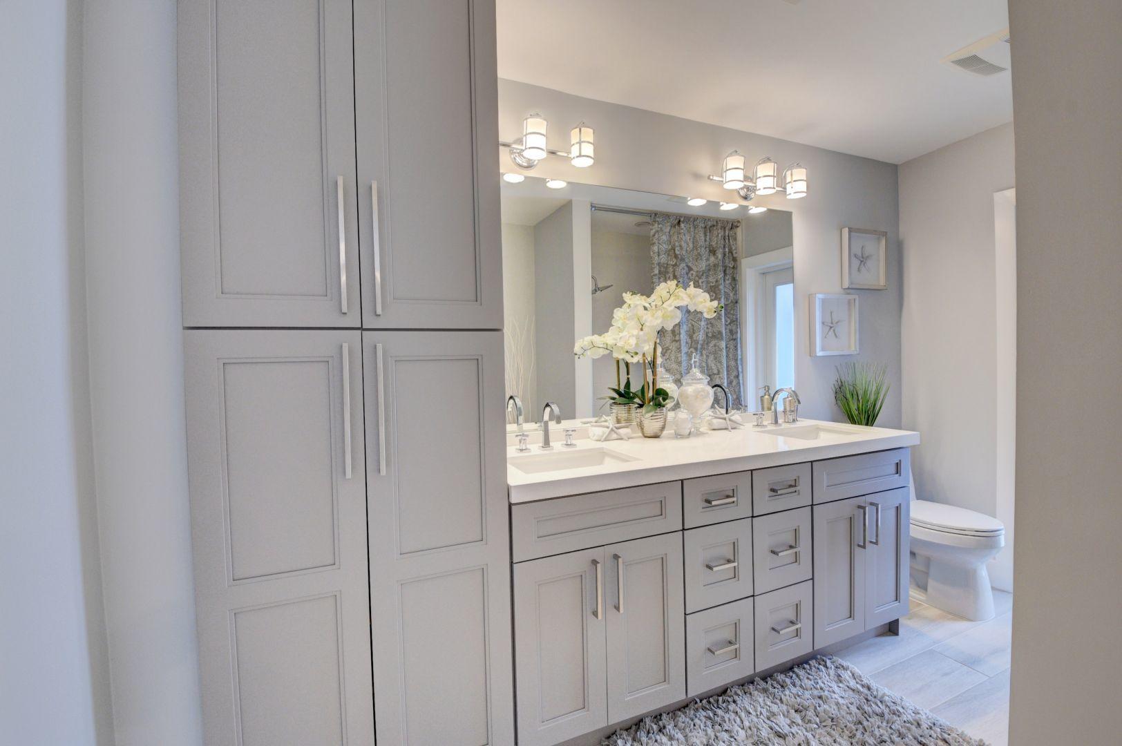 709 Sunshine Drive Delray Beach, FL 33444 - Photo 20 of 25 a bathroom with a double vanity sink and a mirror