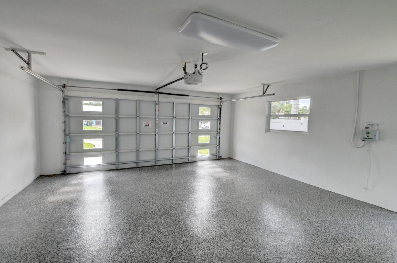 709 Sunshine Drive Delray Beach, FL 33444 - Photo 22 of 25 a view of an empty room with window and wooden floor