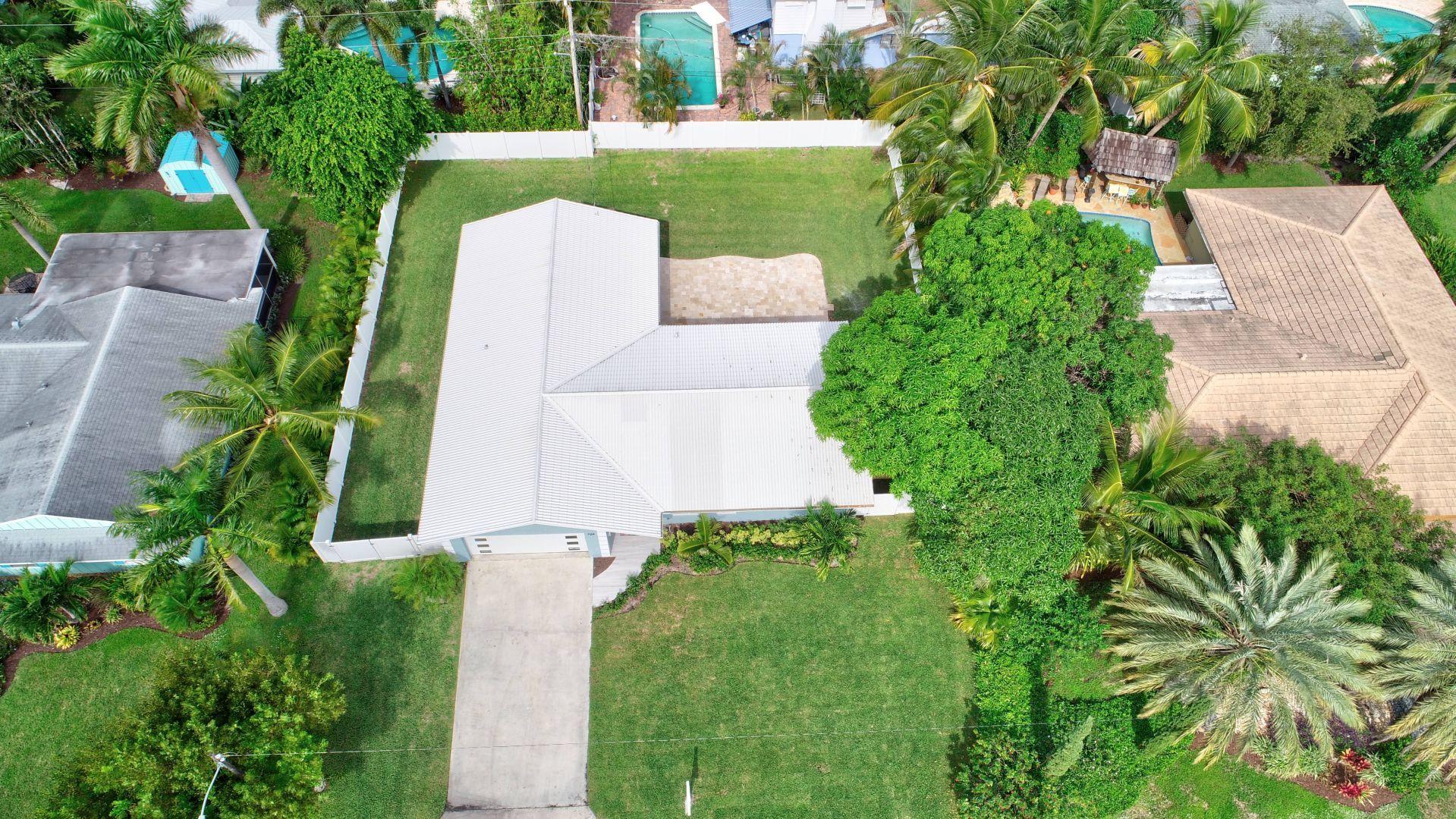 709 Sunshine Drive Delray Beach, FL 33444 - Photo 24 of 25 an aerial view of a house with outdoor space and street view