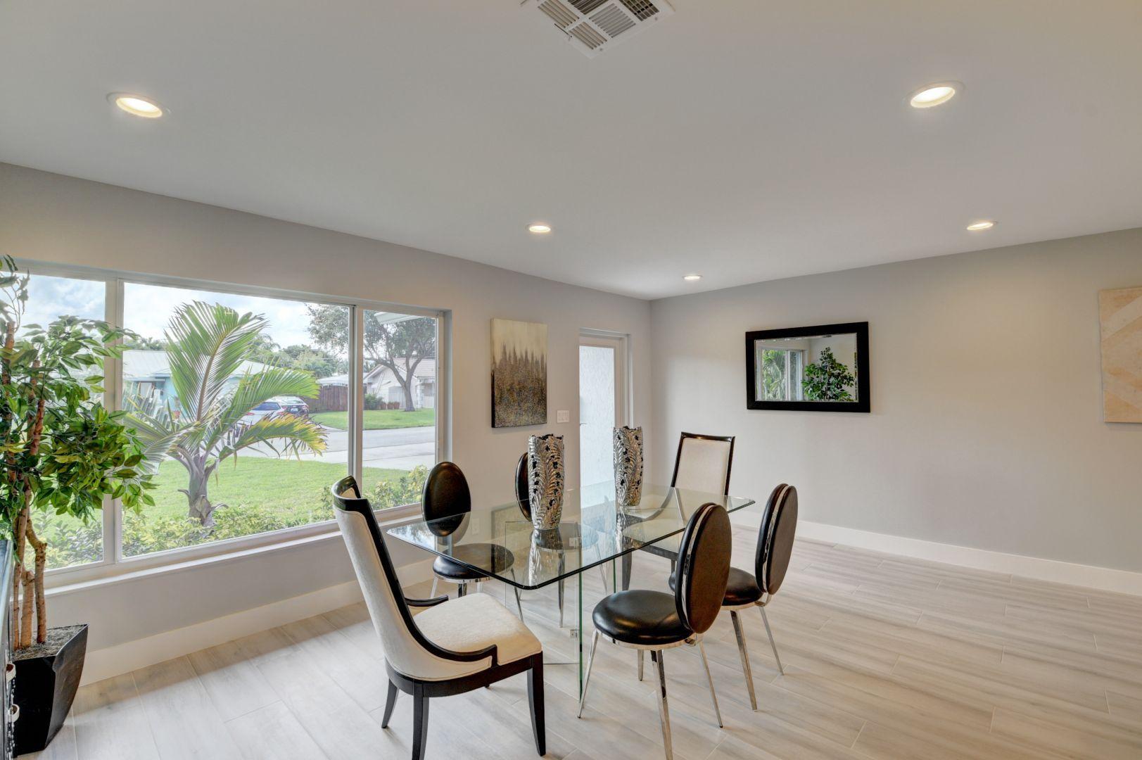 709 Sunshine Drive Delray Beach, FL 33444 - Photo 8 of 25 a living room with furniture and a large window