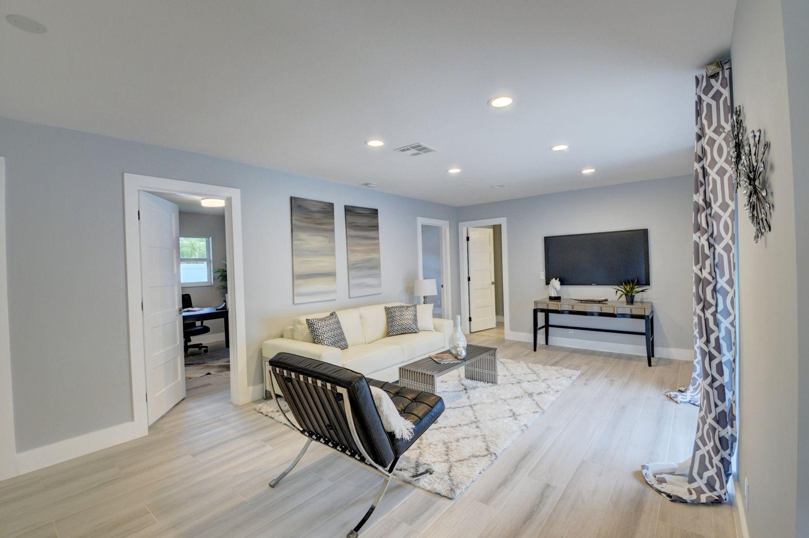 709 Sunshine Drive Delray Beach, FL 33444 - Photo 10 of 25 a living room with furniture and a flat screen tv