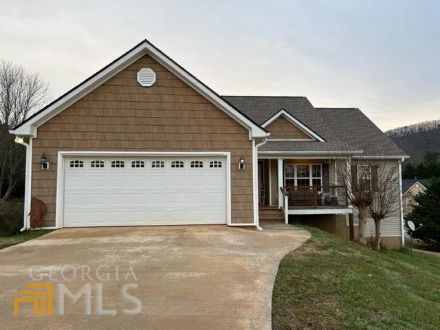 147 Campground Road Cleveland, GA 30528 - Photo 1 of 1 a front view of a house with a yard and garage