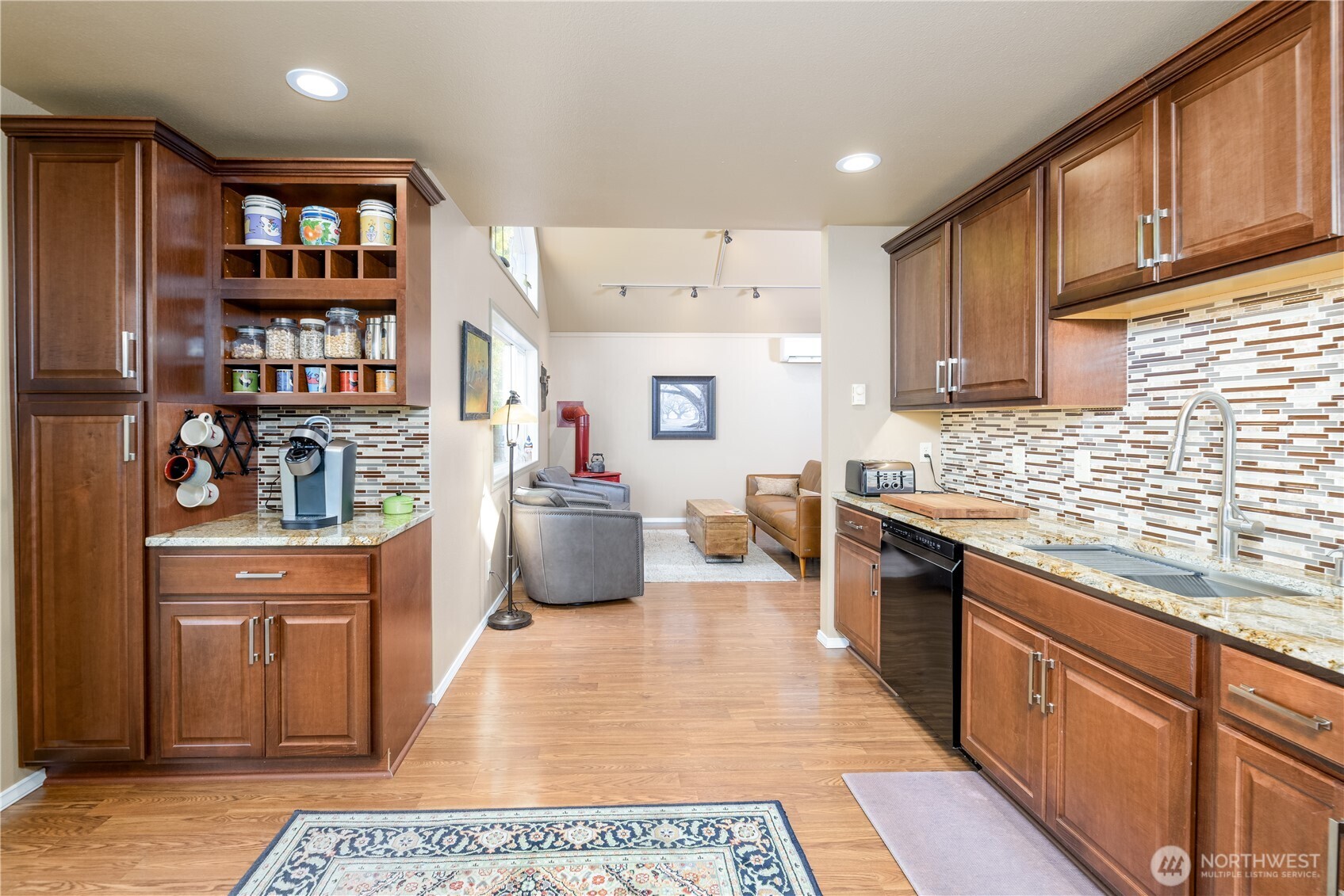 3718 Sequim-Dungeness Way Sequim, WA 98382 - Photo 15 of 40 a kitchen with stainless steel appliances granite countertop a stove a sink and a refrigerator