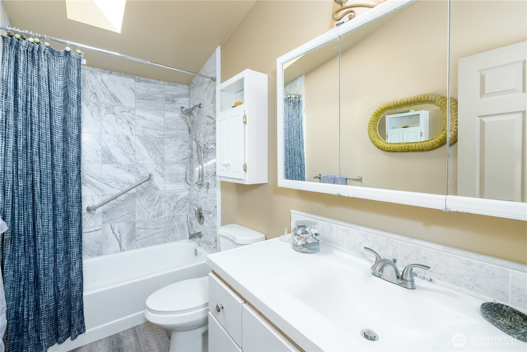 3718 Sequim-Dungeness Way Sequim, WA 98382 - Photo 21 of 40 a bathroom with a sink mirror toilet and bathtub
