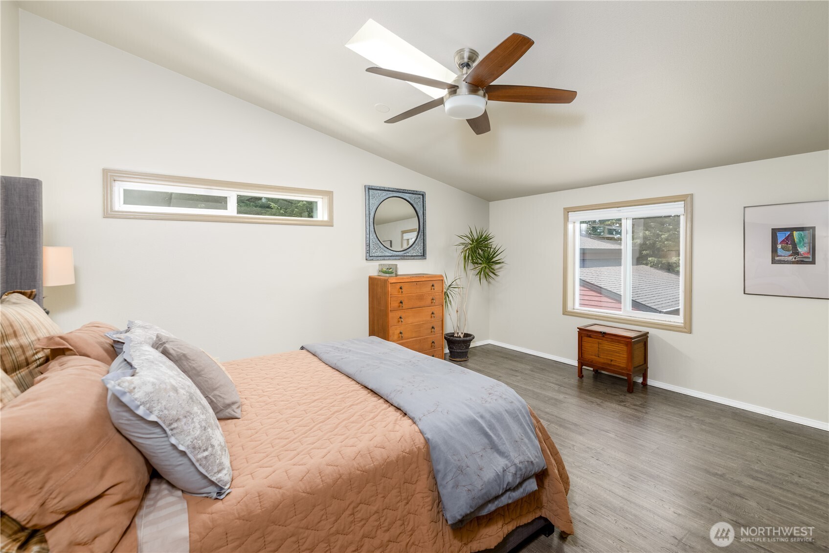 3718 Sequim-Dungeness Way Sequim, WA 98382 - Photo 23 of 40 a bedroom with a large bed and a window