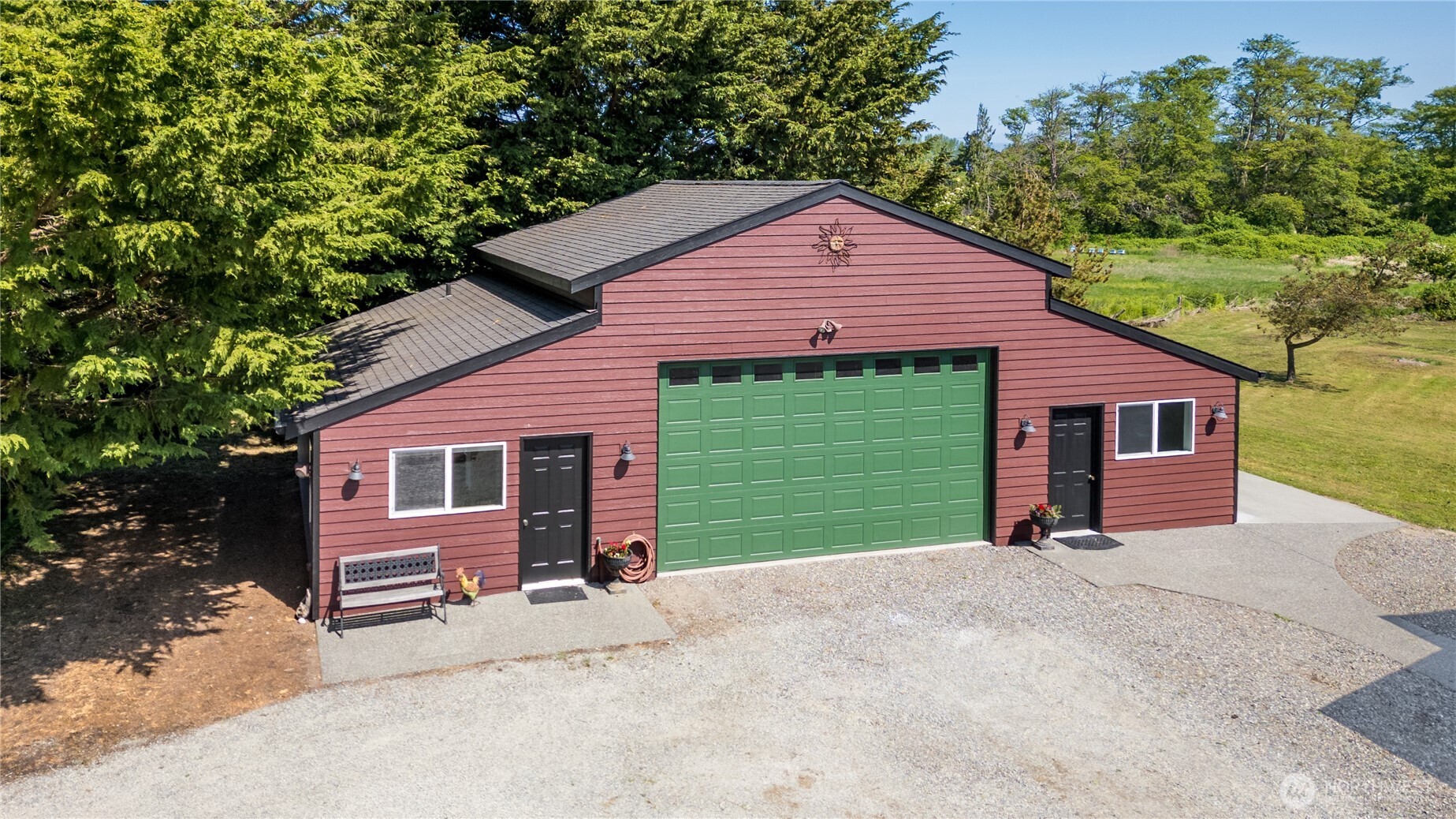 3718 Sequim-Dungeness Way Sequim, WA 98382 - Photo 24 of 40 a front view of a house with a yard and garage