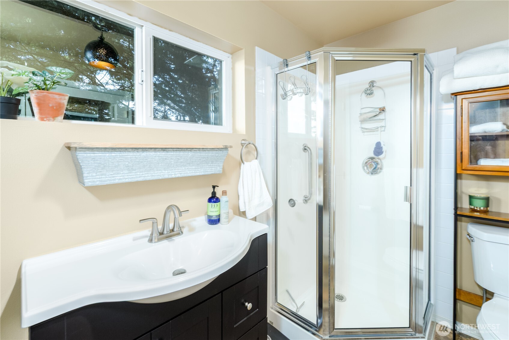 3718 Sequim-Dungeness Way Sequim, WA 98382 - Photo 27 of 40 a bathroom with a sink a mirror and shower