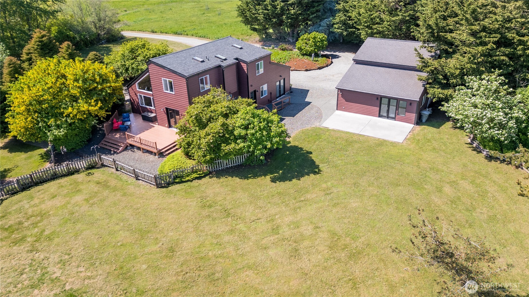 3718 Sequim-Dungeness Way Sequim, WA 98382 - Photo 34 of 40 an aerial view of a house with a yard and trees