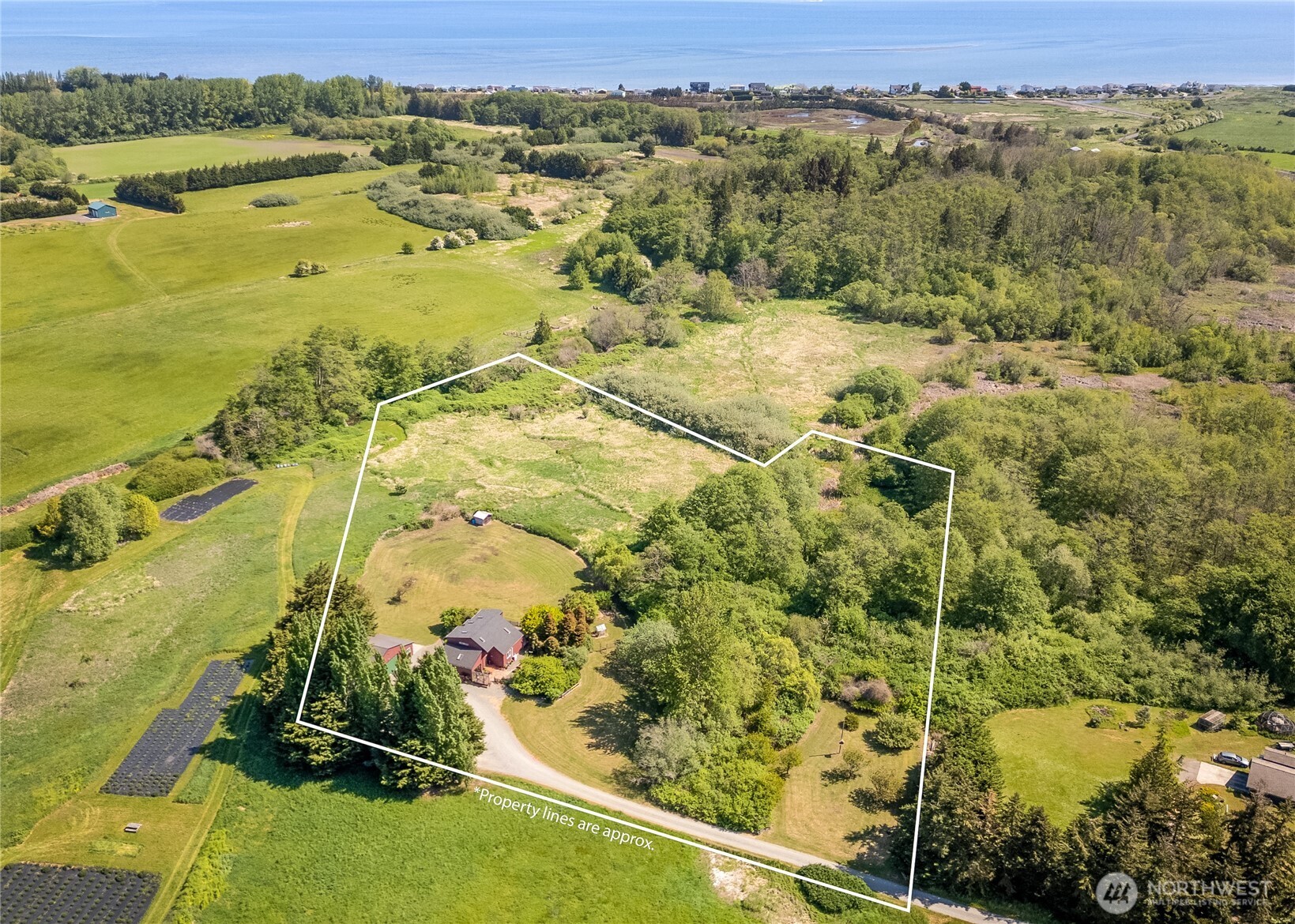 3718 Sequim-Dungeness Way Sequim, WA 98382 - Photo 39 of 40 an aerial view of residential houses with outdoor space
