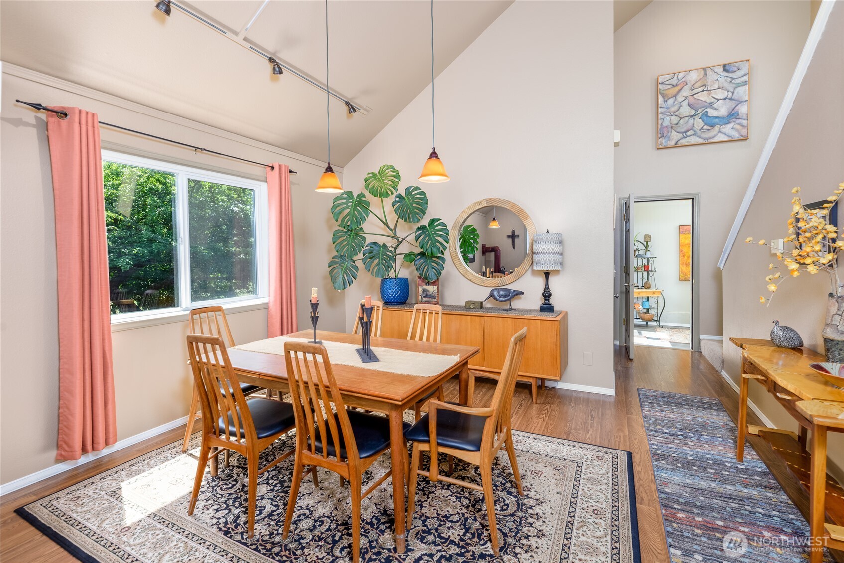 3718 Sequim-Dungeness Way Sequim, WA 98382 - Photo 8 of 40 a view of a dining room with furniture a rug and wooden floor