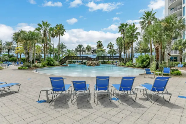 a lake view with tables and chairs