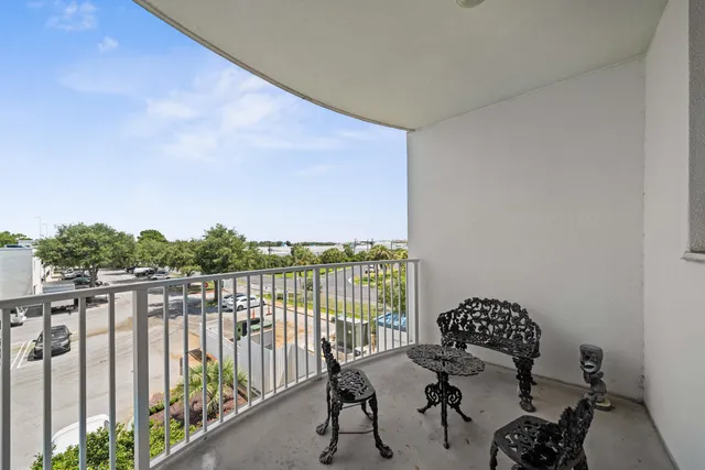 a view of a balcony with chairs