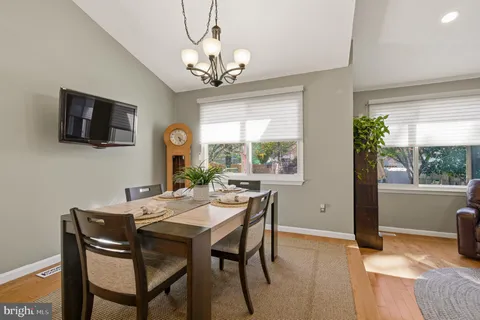 a living room with furniture and a ceiling fan
