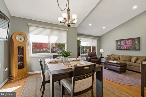 a view of a livingroom with furniture and a window
