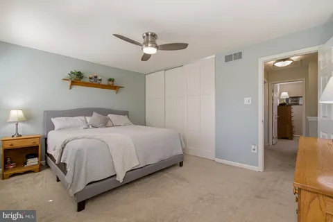 a bed room with a bed and a window