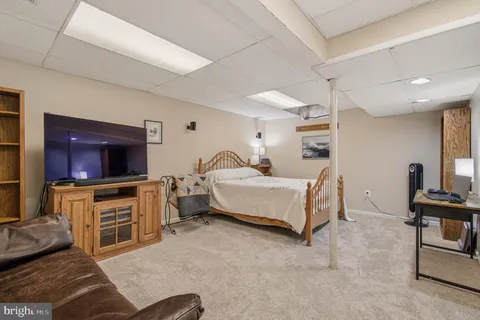 a house with swimming pool in front of it