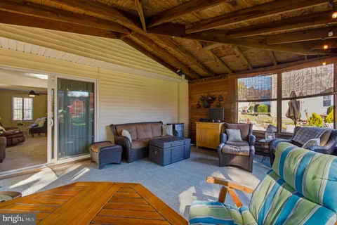 a front view of a house with a yard table and chairs