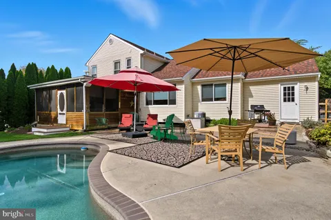 an aerial view of a house with outdoor space