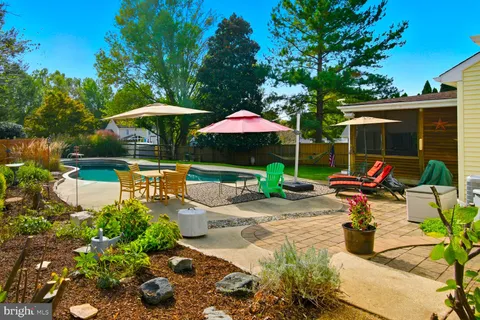a aerial view of a house with a yard