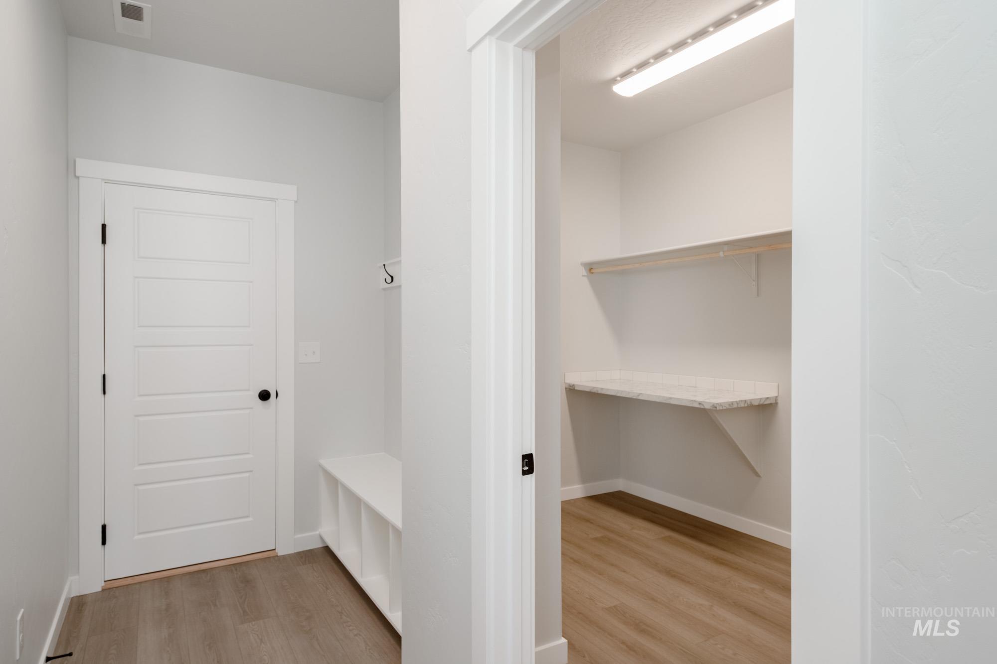 5131 Castleton Avenue Nampa, ID 83686 - Photo 14 of 25 Mudroom featuring light wood finished floors and baseboards