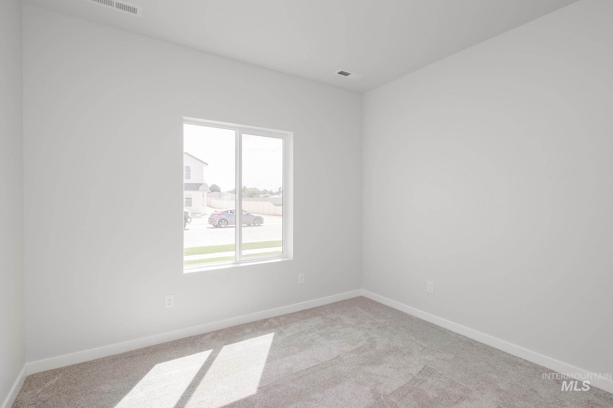5131 Castleton Avenue Nampa, ID 83686 - Photo 15 of 25 Carpeted spare room featuring baseboards