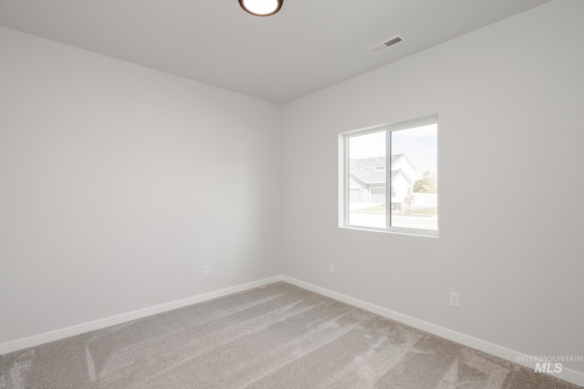 5131 Castleton Avenue Nampa, ID 83686 - Photo 16 of 25 Unfurnished room featuring light carpet and baseboards