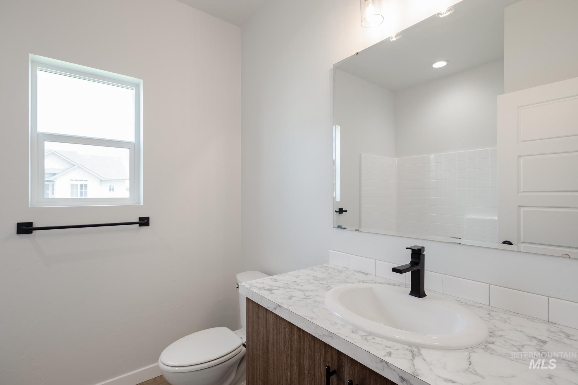5131 Castleton Avenue Nampa, ID 83686 - Photo 17 of 25 Bathroom featuring vanity and toilet