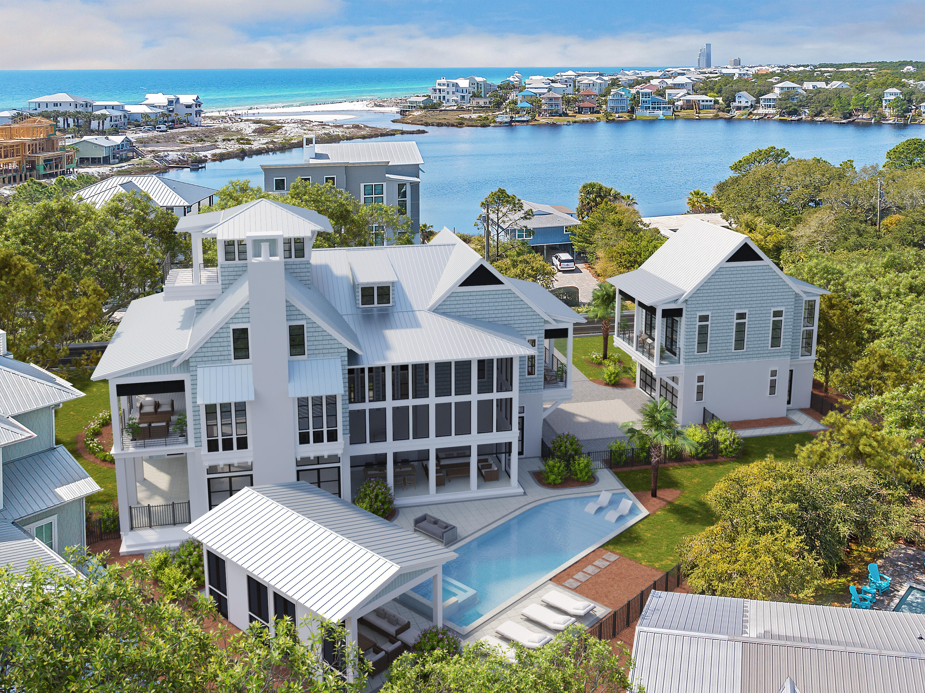 an aerial view of a house with a garden and lake view