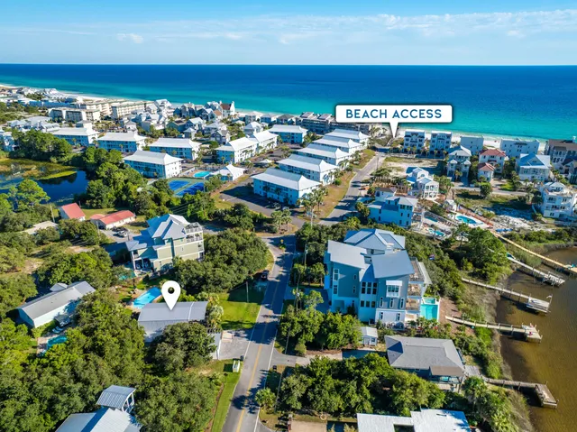 an aerial view of ocean residential house with outdoor space and trees around