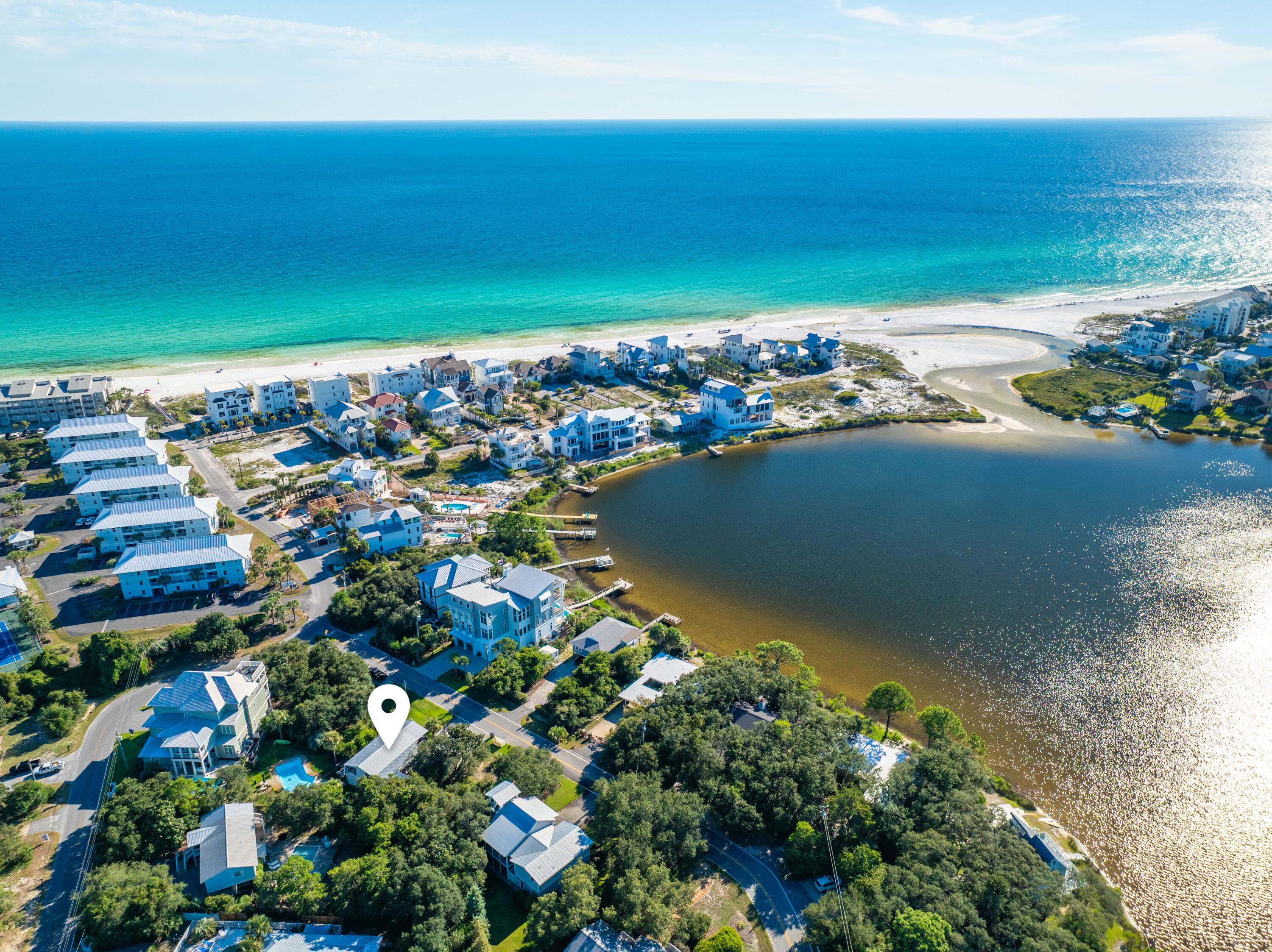 288 Lakeview Drive Santa Rosa Beach, FL 32459 - Photo 15 of 28 a view of a lake with a building in the background
