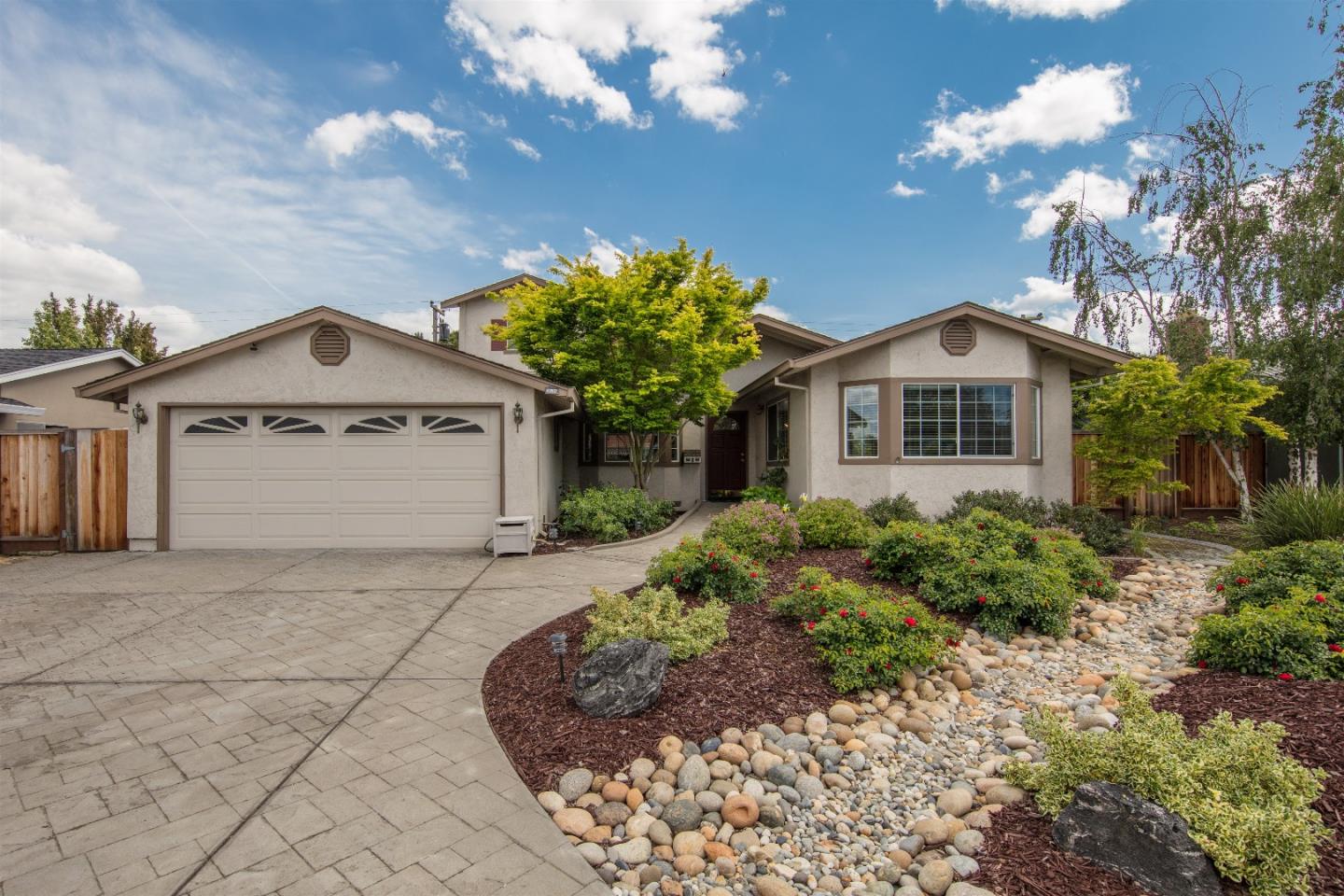 1686 Ebbetts Drive Campbell, CA 95008 - Photo 1 of 31 a front view of a house with a yard and garage