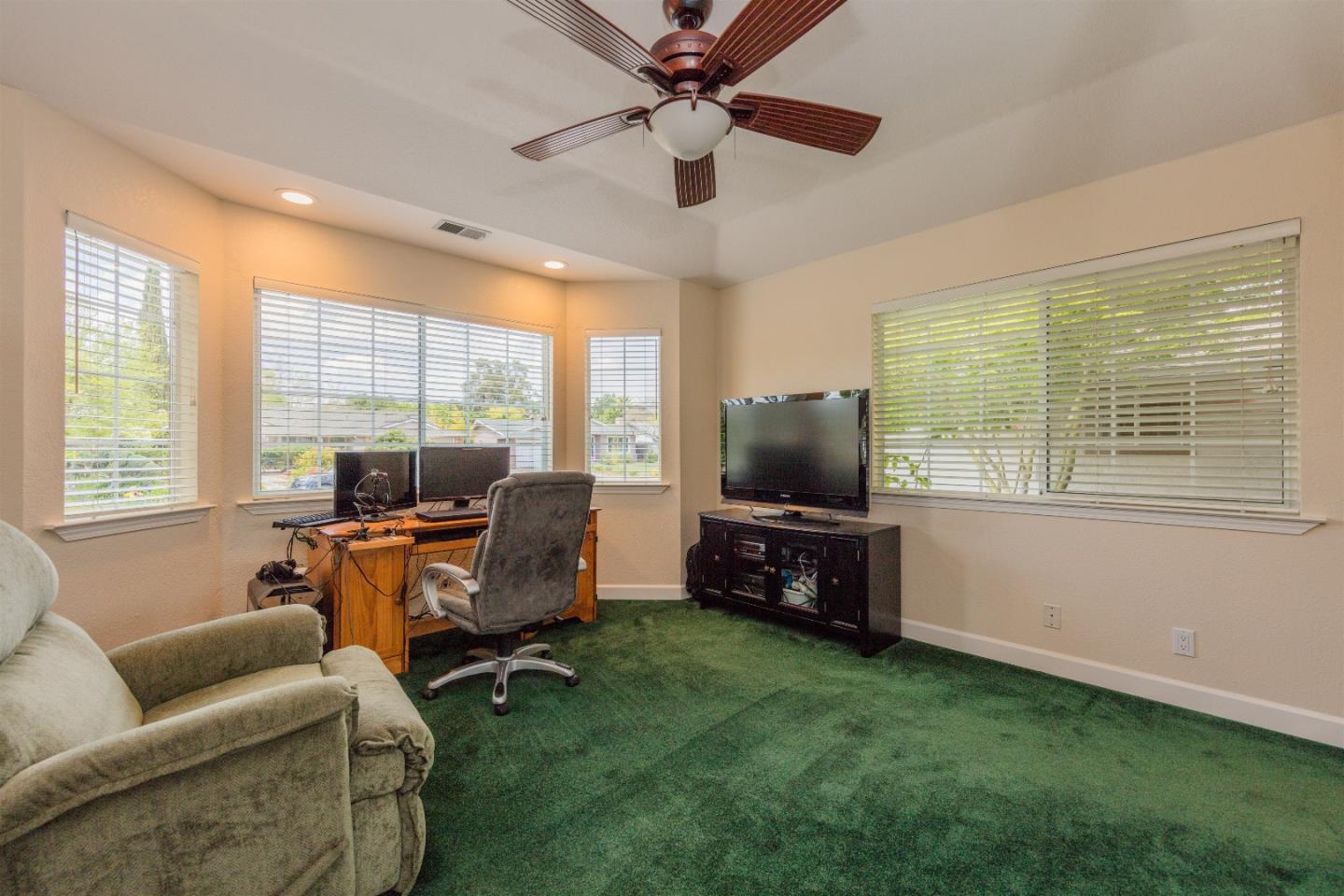1686 Ebbetts Drive Campbell, CA 95008 - Photo 13 of 31 a living room with furniture and a flat screen tv