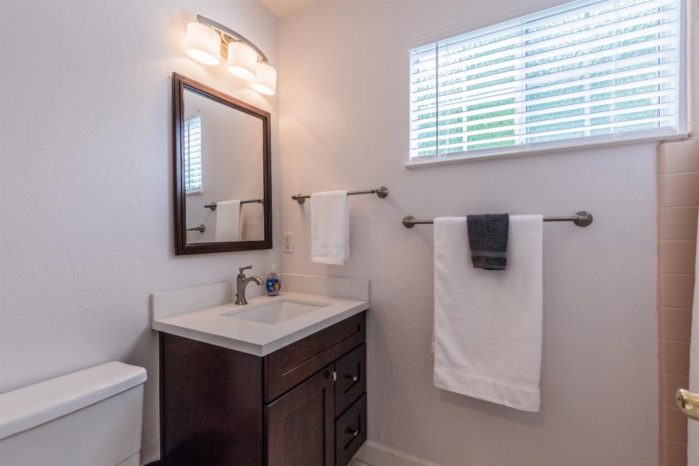 1686 Ebbetts Drive Campbell, CA 95008 - Photo 14 of 31 a bathroom with a sink and a mirror