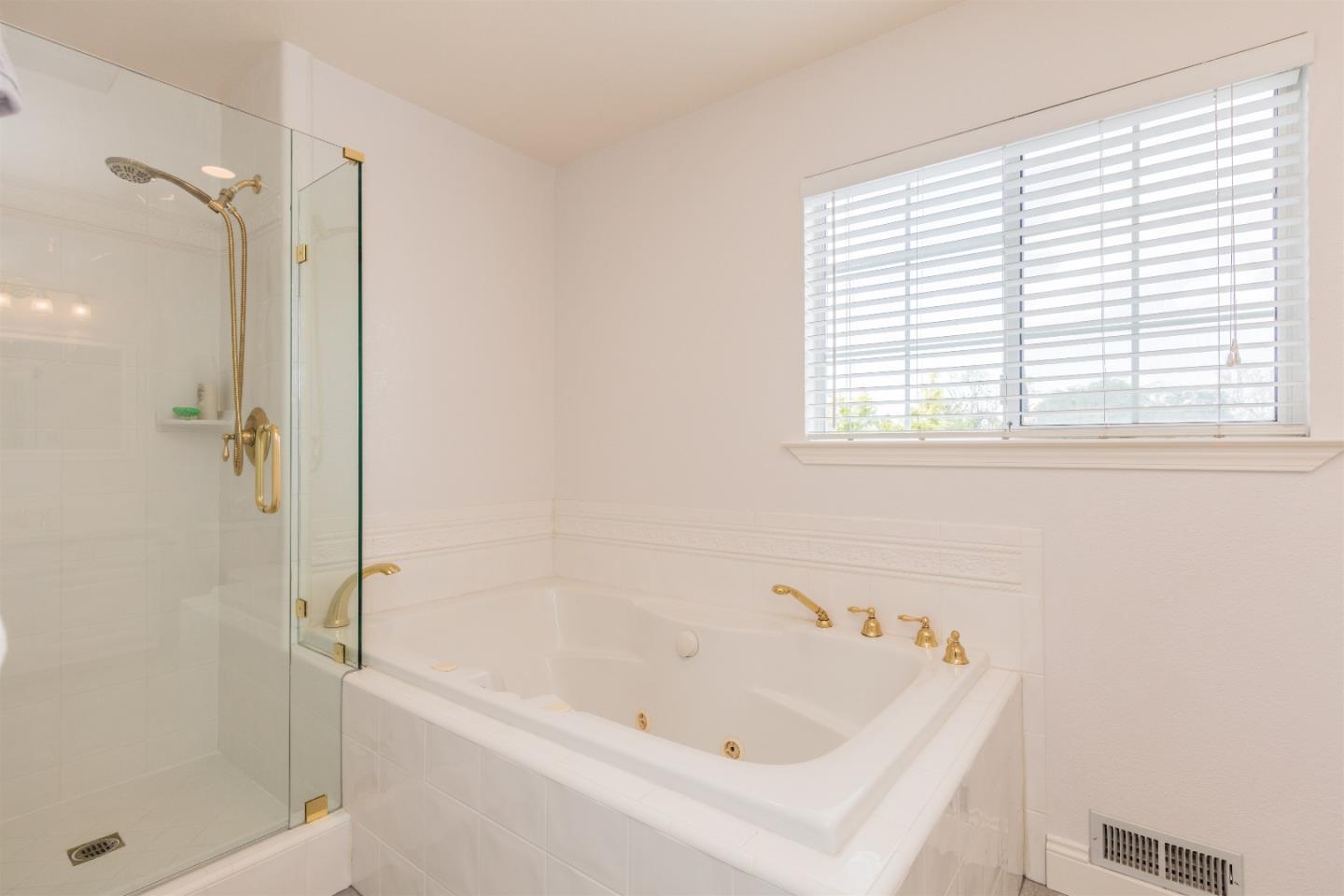 1686 Ebbetts Drive Campbell, CA 95008 - Photo 24 of 31 a white bath tub sitting next to a shower